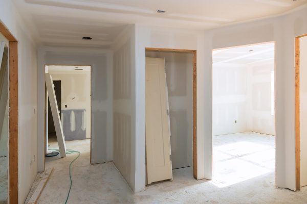 Construction building industry new home construction interior drywall tape and finish details installed door for a new home before installing